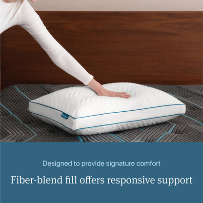 Woman pressing her hand on a Beautyrest Down Alternative Pillow
