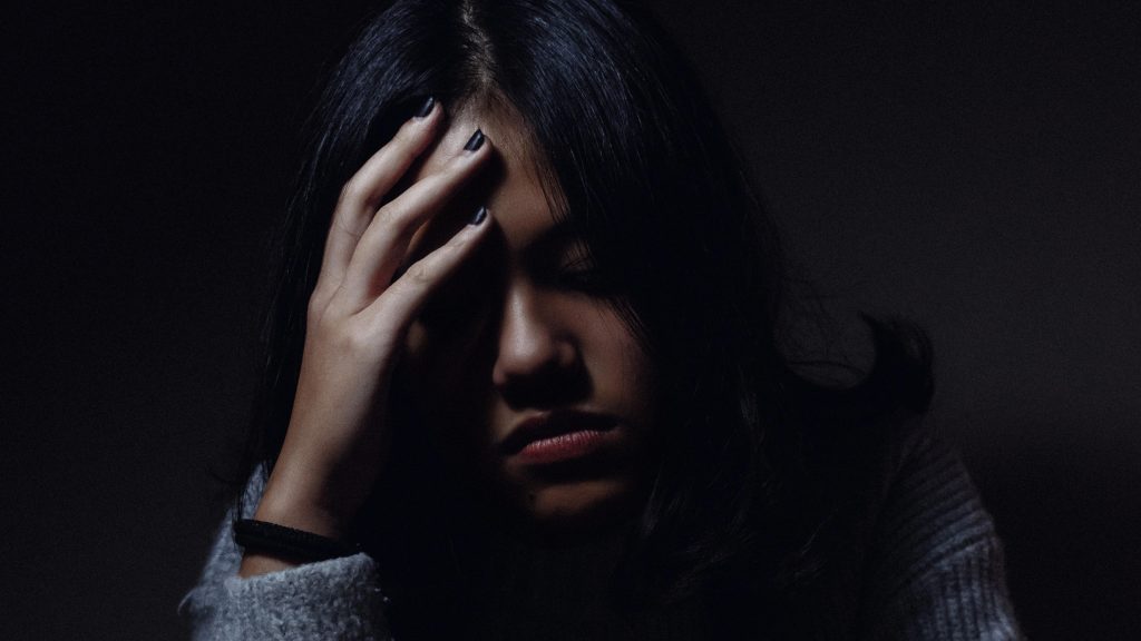 Woman rubbing her head