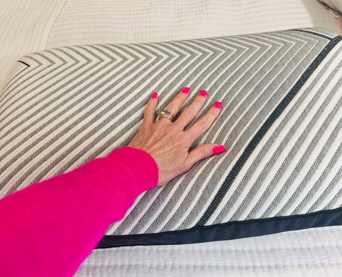 Dr. Caroline Leafs left hand touching to Beautyrest Black Luxury foam pillow