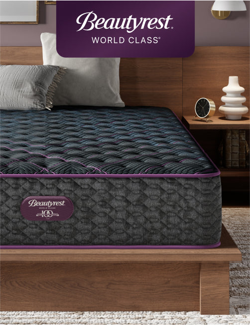Beautyrest World Class mattress sitting in a brown bed frame with 2 pillows on top of it